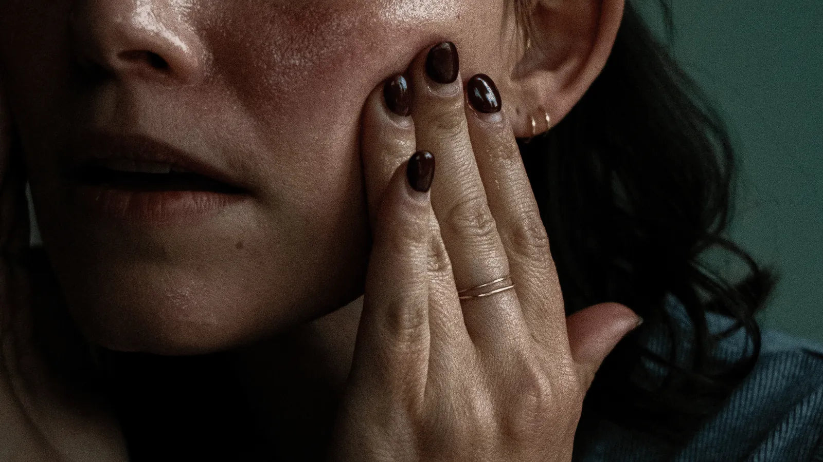 A woman pressing Amaroo Naturals emu oil into her cheek