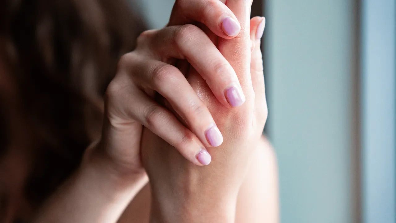 A woman rubbing Amaroo Naturals pure emu oil into her hands
