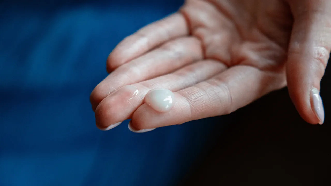 A drop of Amaroo Naturals pure emu oil in the palm of a hand