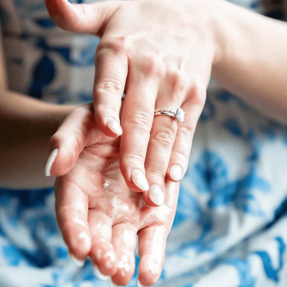 Person rubbing Amaroo Naturals emu oil into their hands