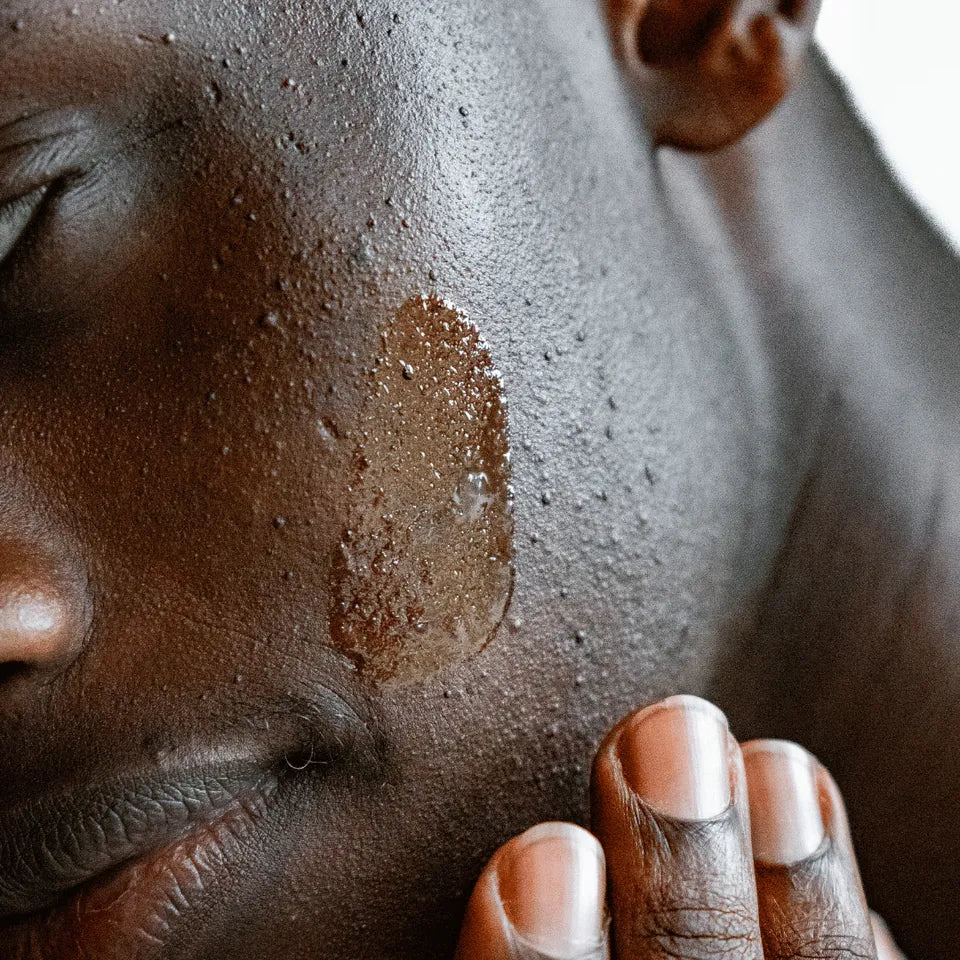 Person rubbing Amaroo Naturals emu oil onto their face